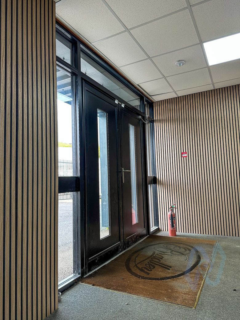 The new doors from inside the entrance lobby, with no maglocks or exit buttons on the frame