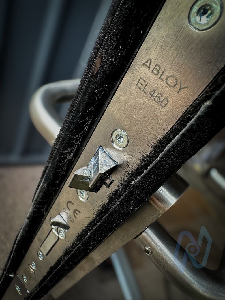 Abloy EL460 lock case fitted in the edge of the door, with its dead bolt and latch