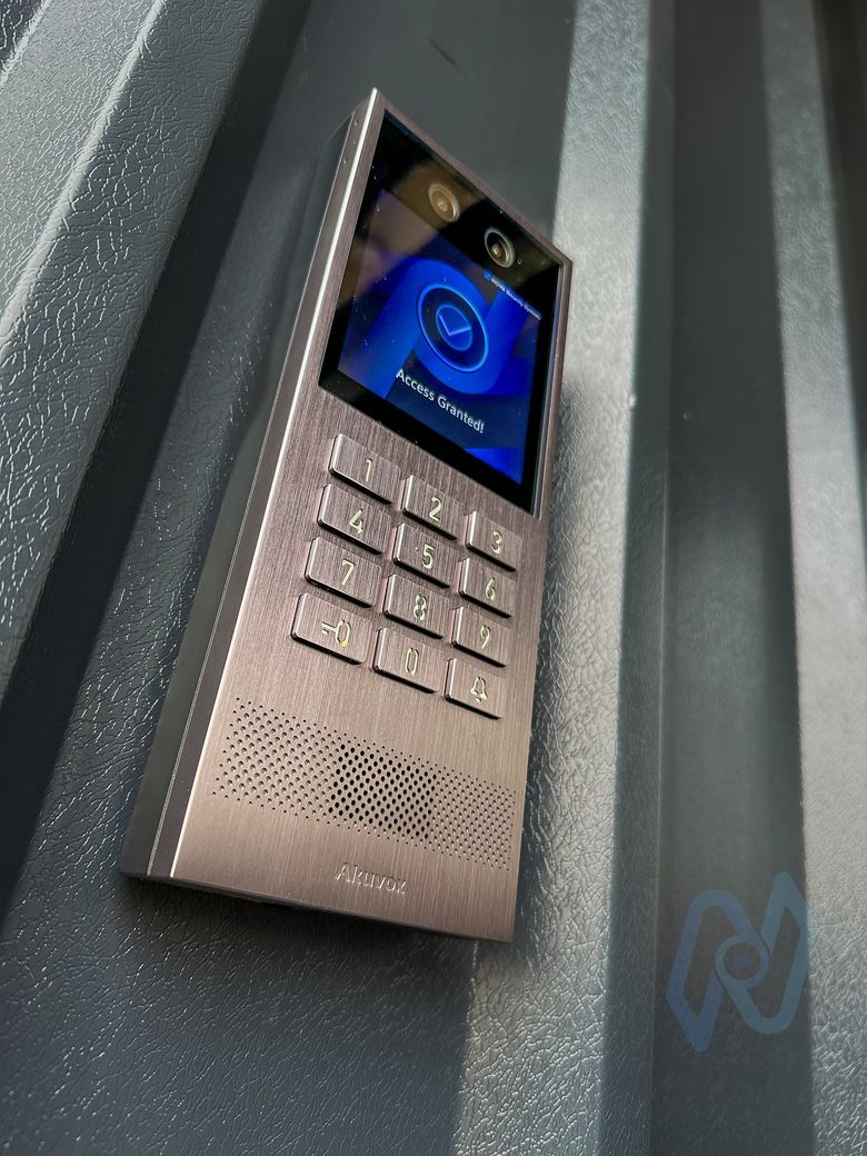 Akuvox X912K intercom showing Access Granted, with keypad, cameras and speaker