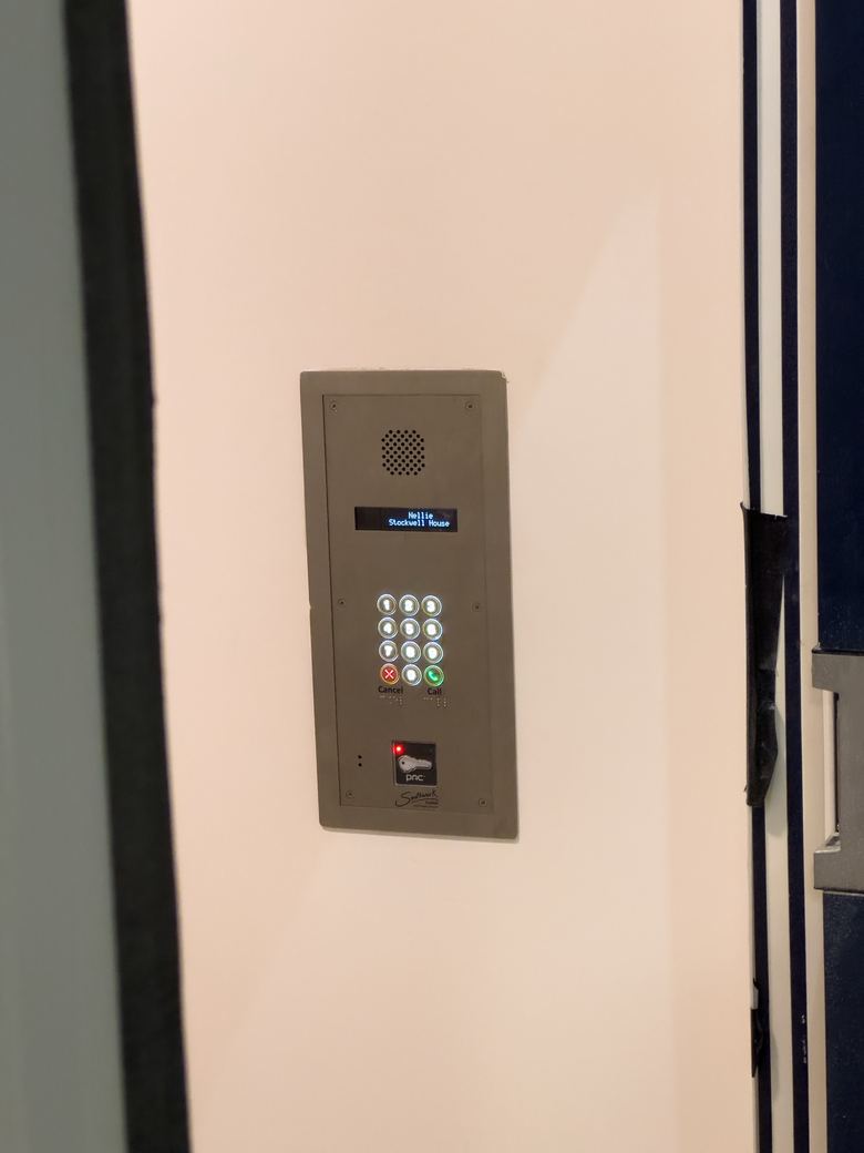 Video door entry panel with keypad at a building entrance