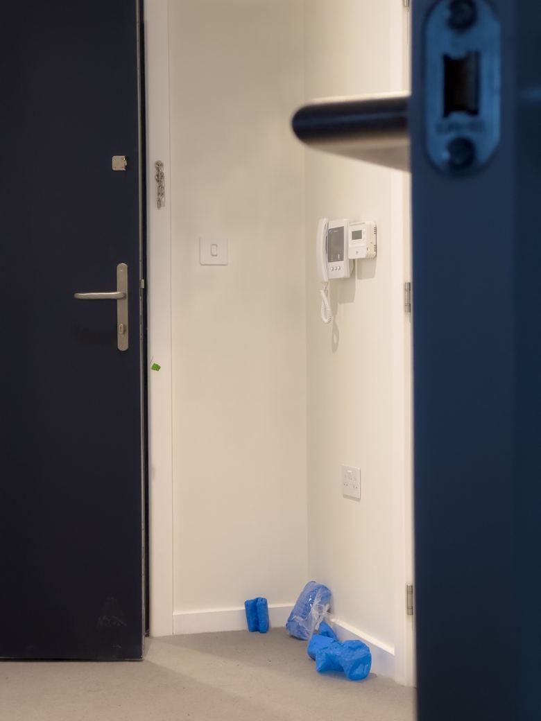 Door entry handset on the wall inside an apartment