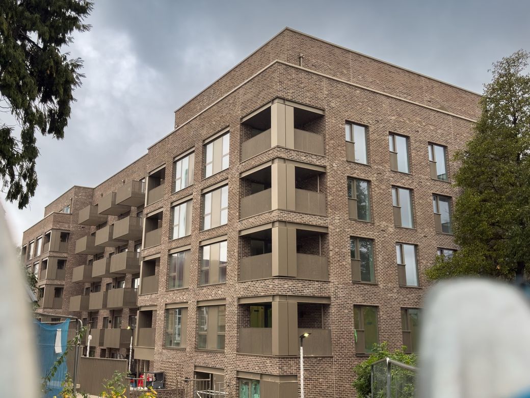 The finished 50-apartment residential development, brick blocks with balconies