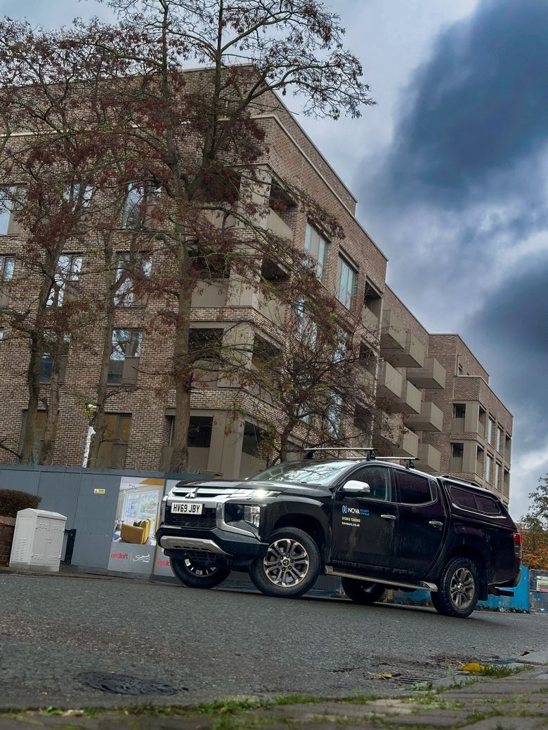 Nova’s pick-up truck outside the apartment development during handover