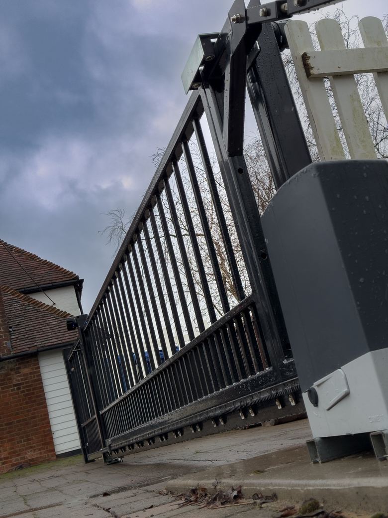 CAME sliding gate motor beside the cantilever gate