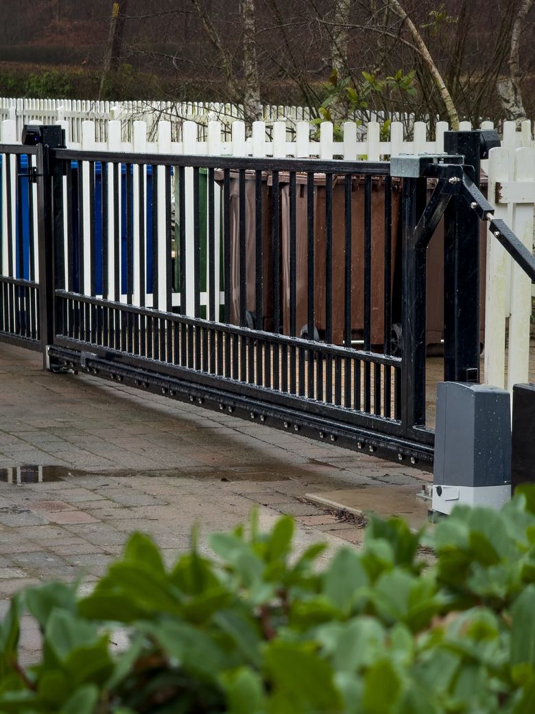 The cantilever gate and pedestrian gate seen from the drive