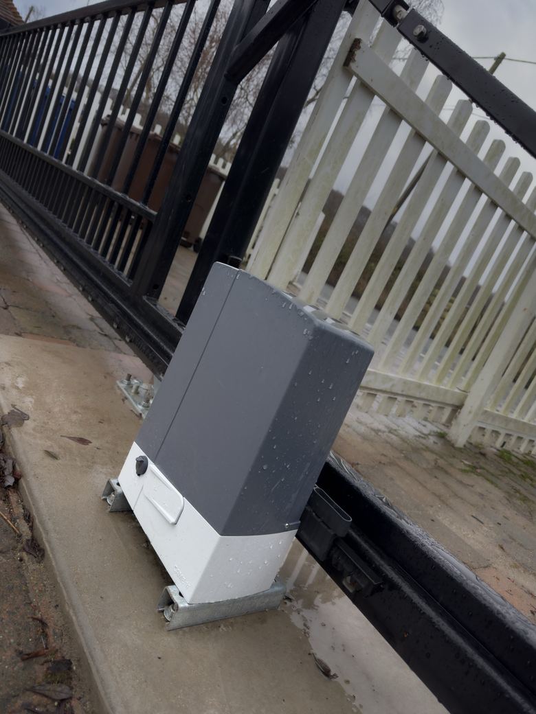 CAME motor on its plinth with the gate’s cantilever rail