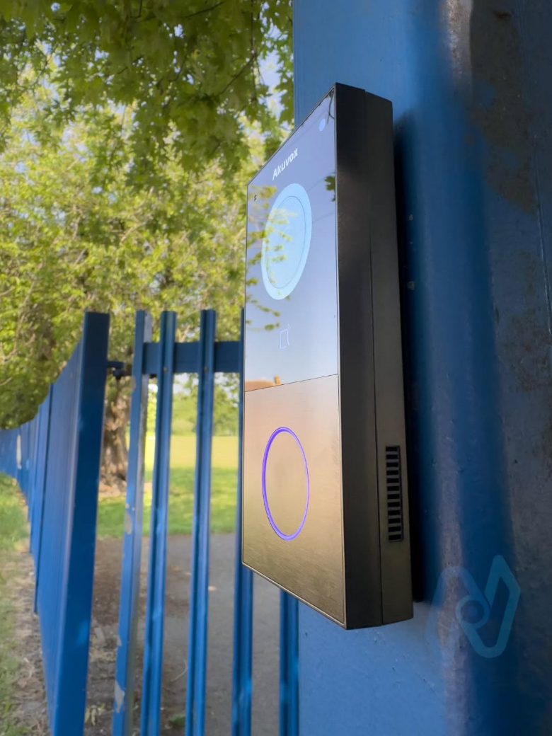 Akuvox E12 video door station mounted on the blue pedestrian gate post