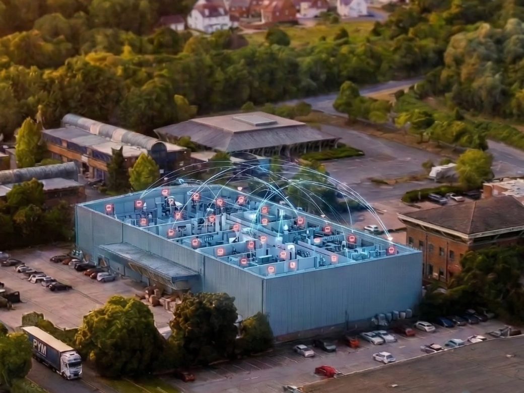 Aerial view of the Fileder Filter Systems warehouse in Maidstone with a graphic of the wireless fire alarm coverage over the roof