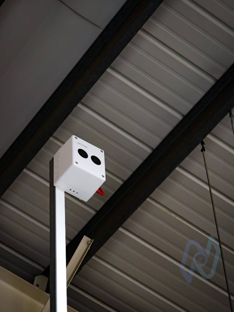 Fire Beam beam detector mounted under the roof on the top floor
