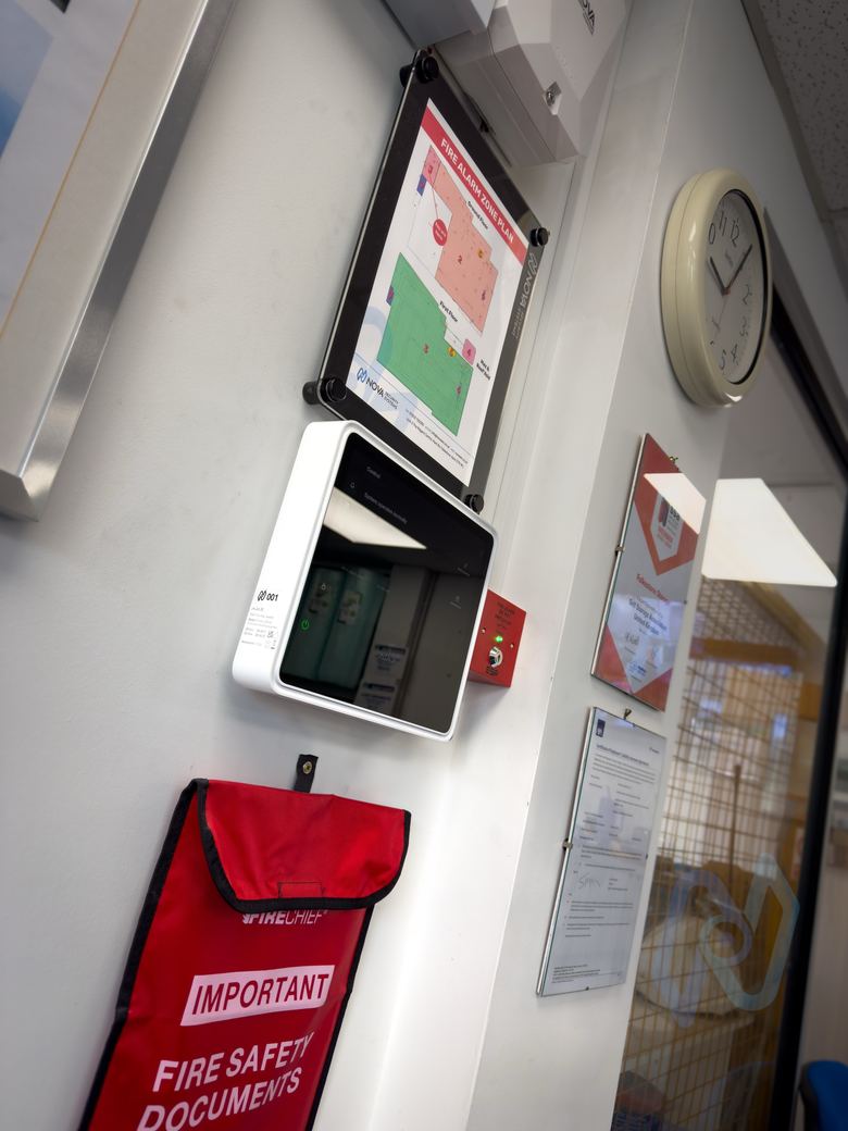 Ajax EN54 Fire Hub beside the fire safety documents box