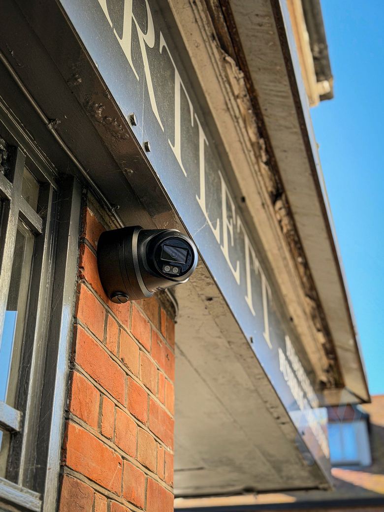 Camera under the fascia, covering the pavement and windows