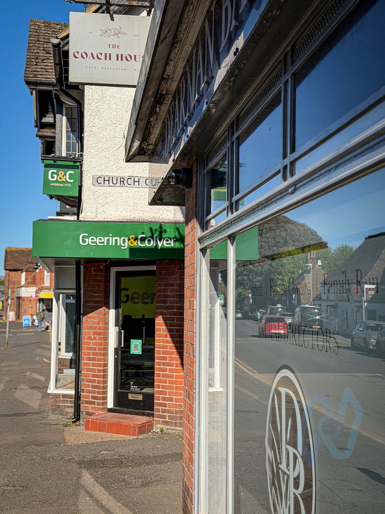 Camera on the shop front, looking along New Romney High Street