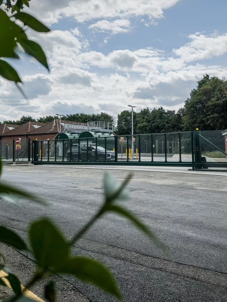 The cantilever gates closed across the entrance road