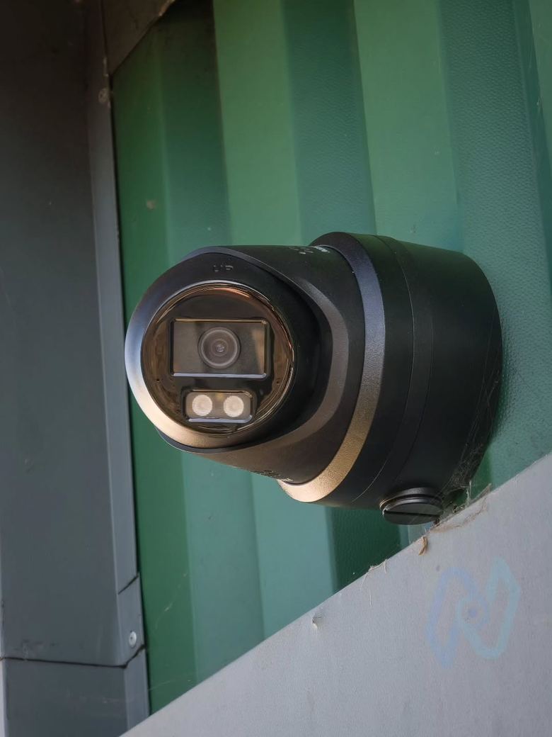 Close-up of a colour turret camera with its white lights and strobe