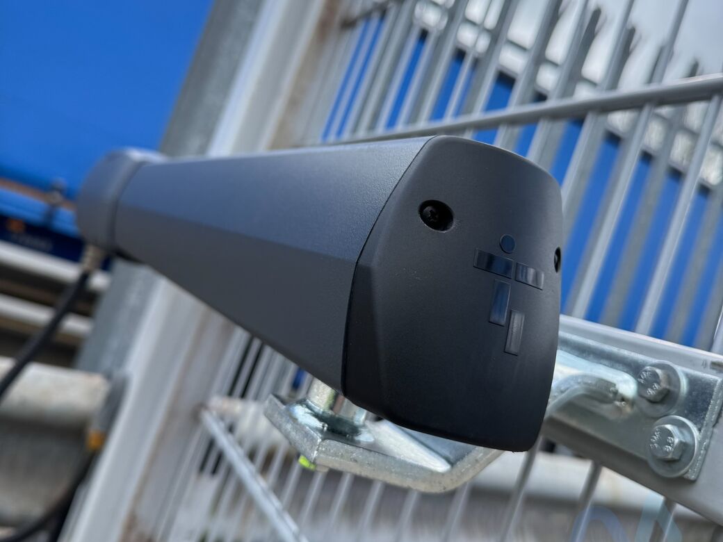 A new CAME ATI motor fitted to a commercial mesh swing gate