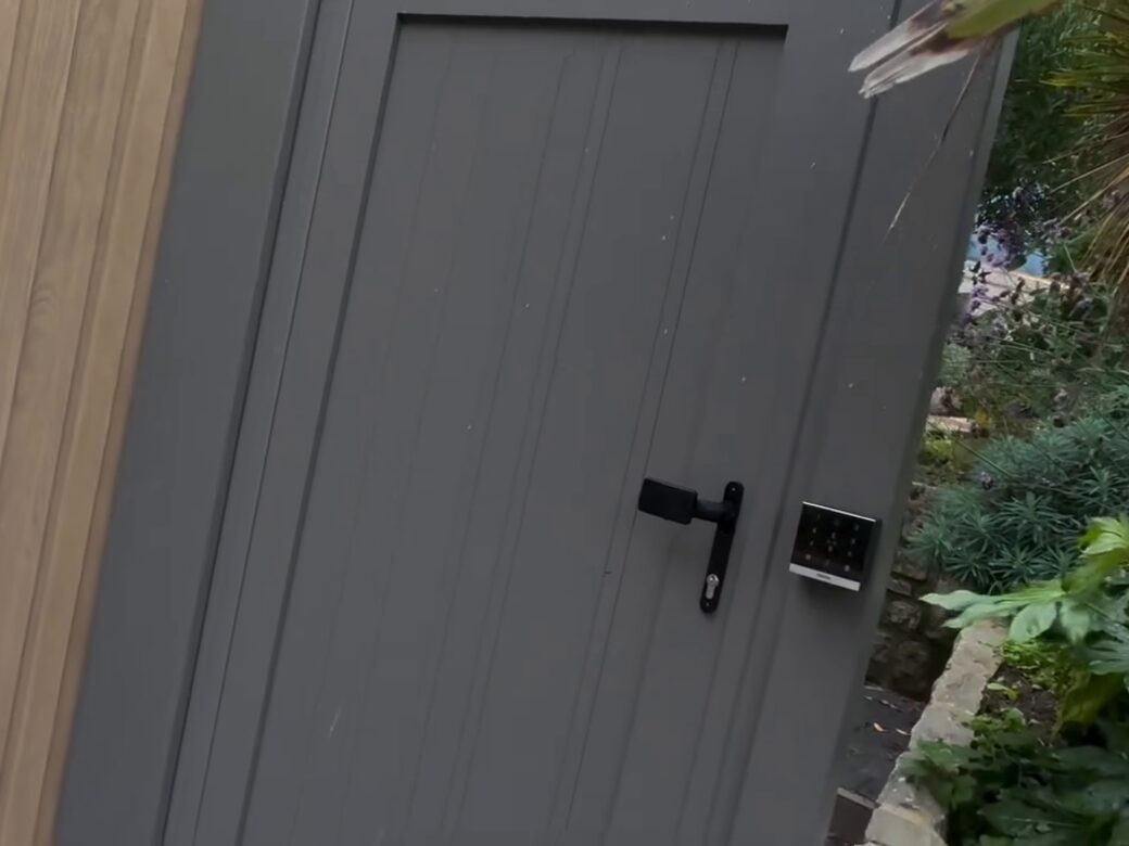 The electric-release pedestrian gate with an Akuvox keypad