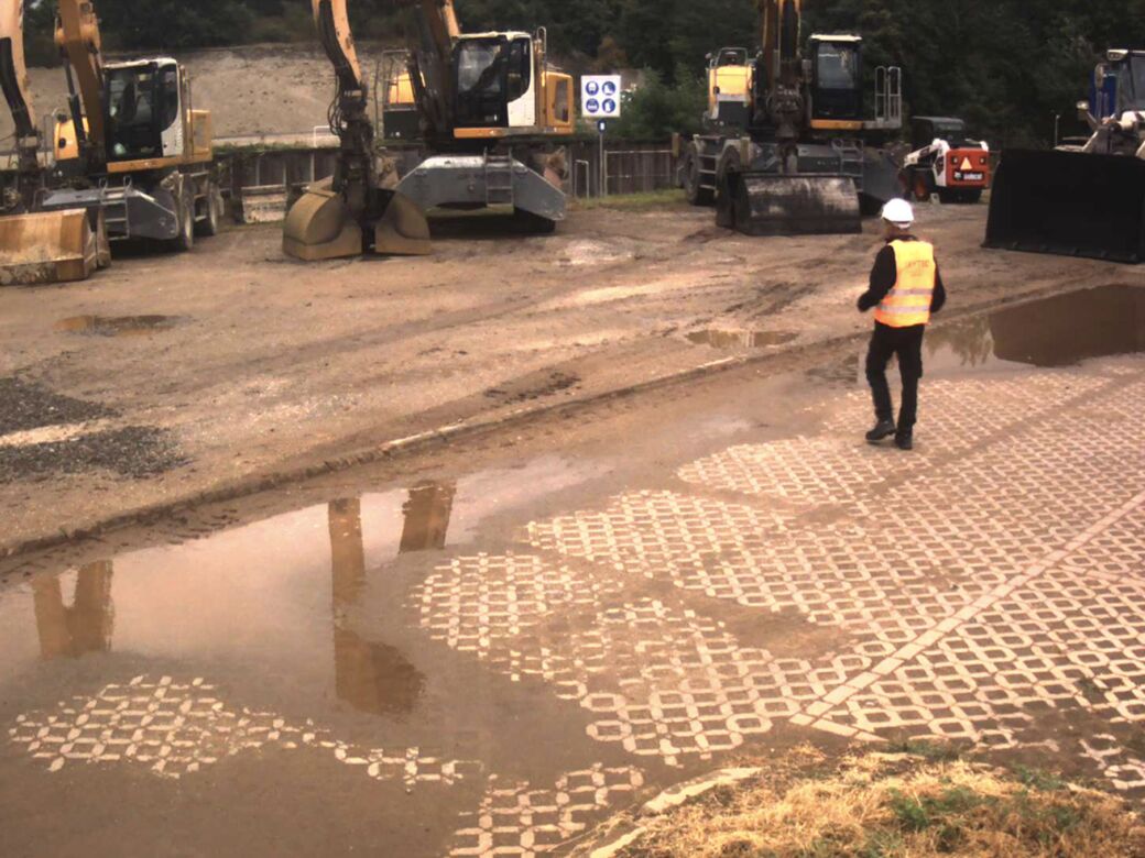 Daytime colour photo of a plant yard with excavators, taken by a Reconeyez detector