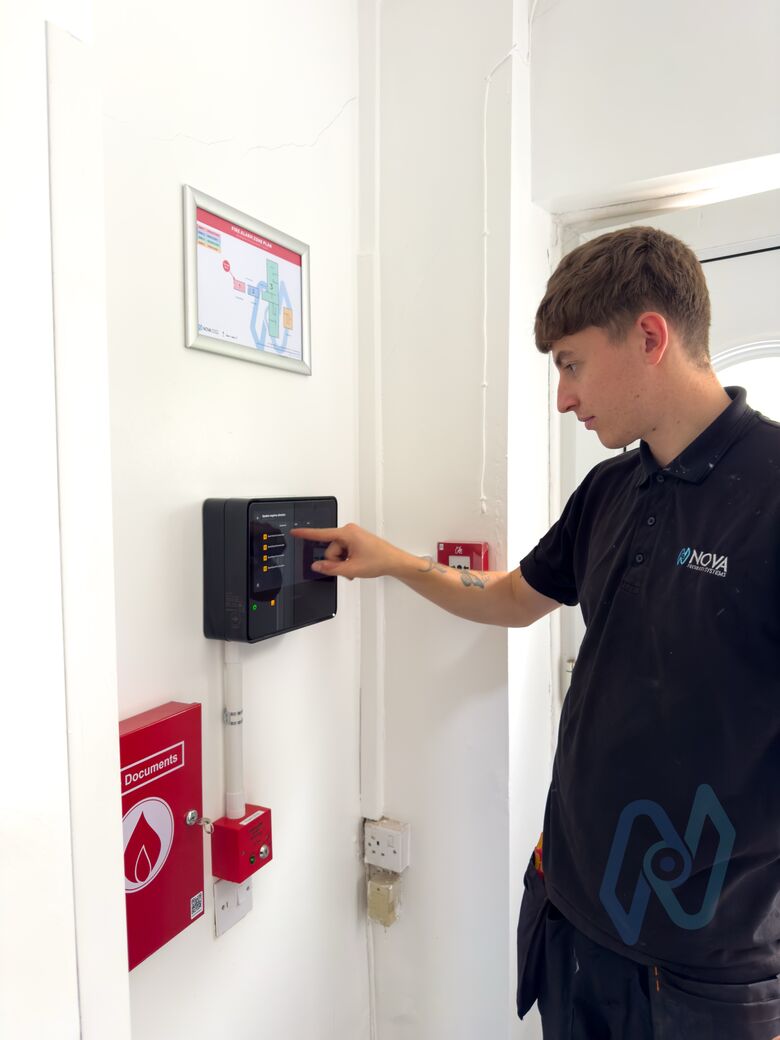 A Nova engineer testing the Ajax EN54 Fire Hub at handover
